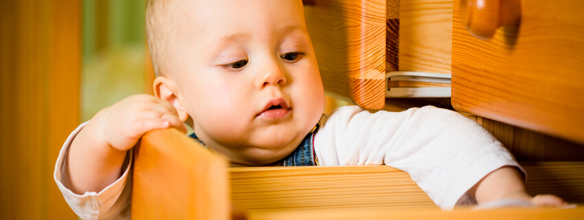 Baby opening a drawer