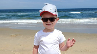 Easton enjoying a beach day