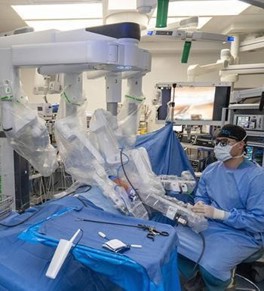 Surgeon at CHKD working the robotic system