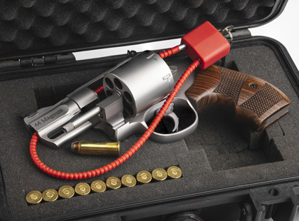 Hand gun with cable key locked on case background