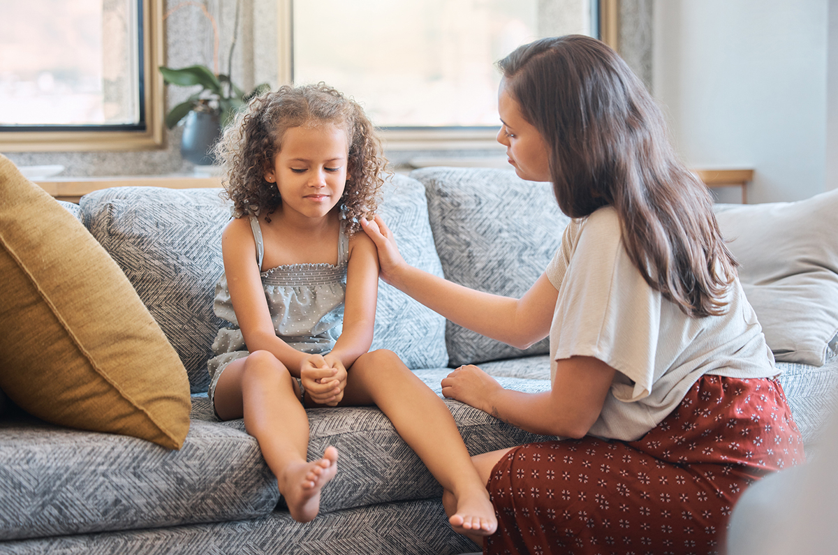 Loving caring mother trying to communicate with upset daughter.