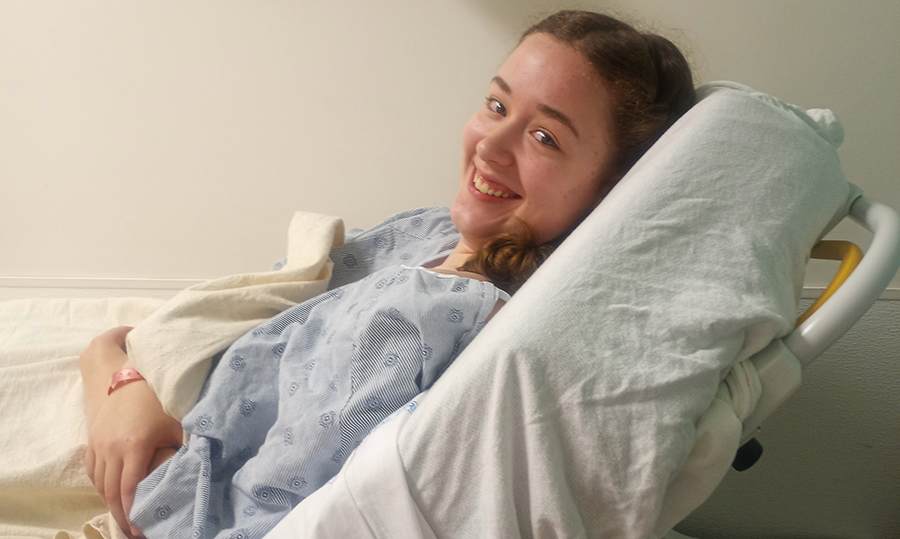 Nuss surgery patient in hospital bed smiling