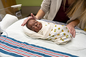 Tristan Waters in an isoclate at CHKD's NICU