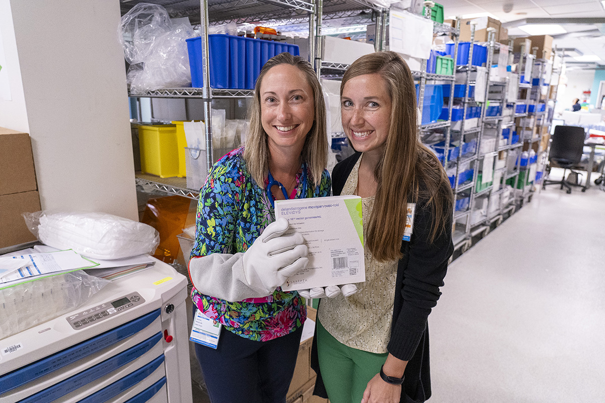 Dr. Crystal Proud and CHKD pharmacist Christina Hellauer in the pharmacy with the first dose of Elevidys.