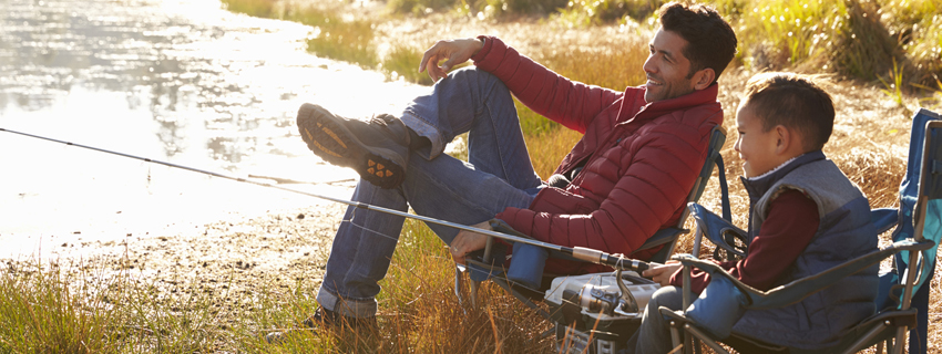 Man and his son fishing.