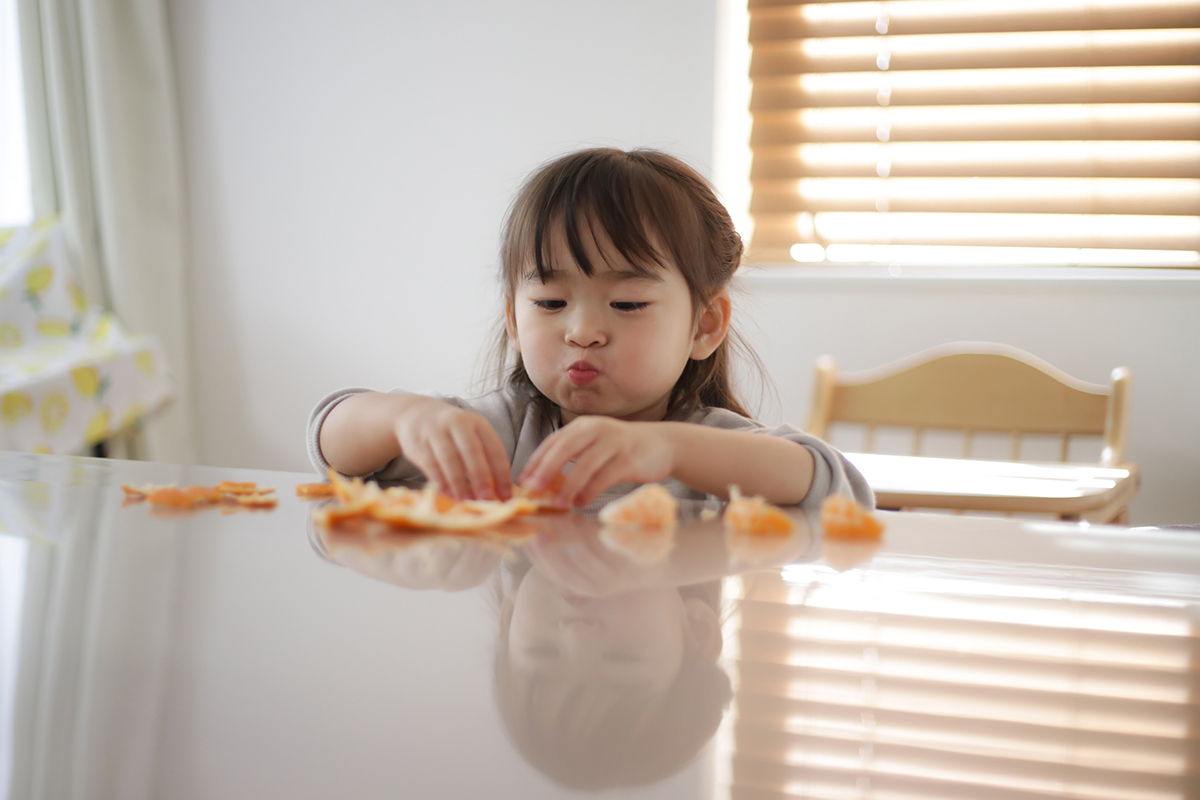 girl eating oranges