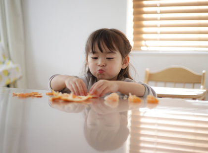 girl eating oranges
