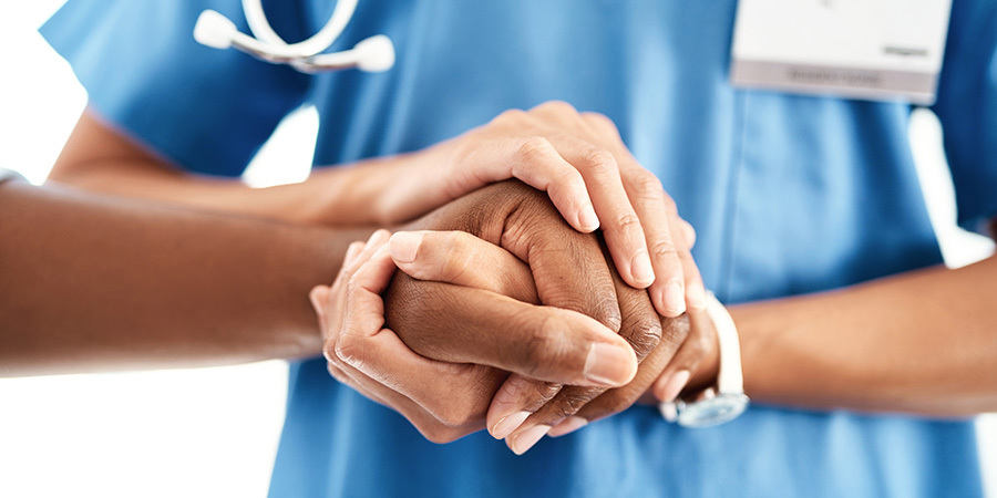 Cropped shot of an unrecognizable female nurse comforting a parent in the hospital.