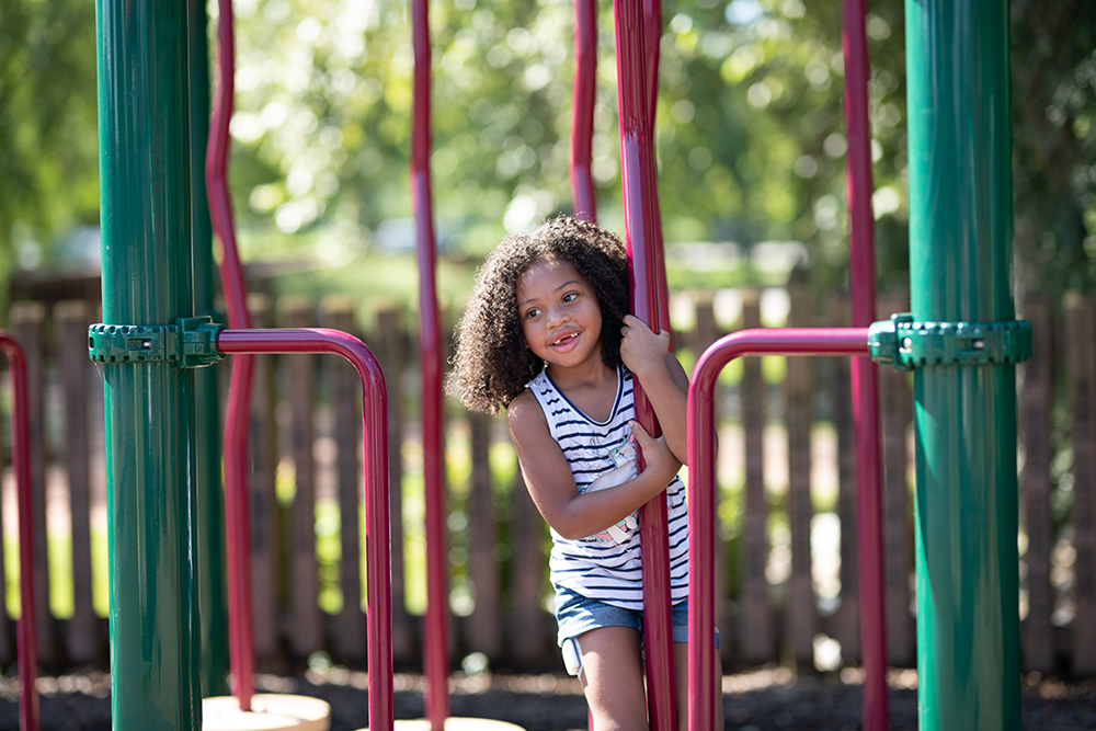 Diabetes patient Autumn Rivera smiling on the playground.