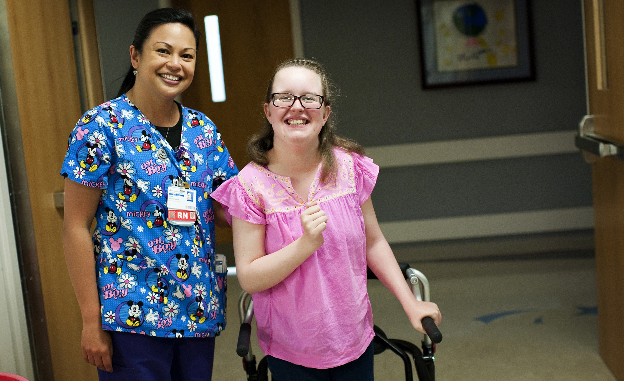 CHKD Nurse Laughing With A Patient With A Walker On The 7Th Floor