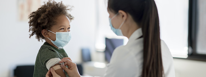 Kid smiling after getting a shot
