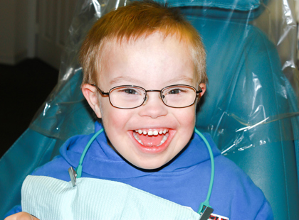 Cute Young Boy With Downs Syndrome at the Dentist