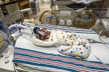 Terry Waters in an isolate at CHKD's NICU