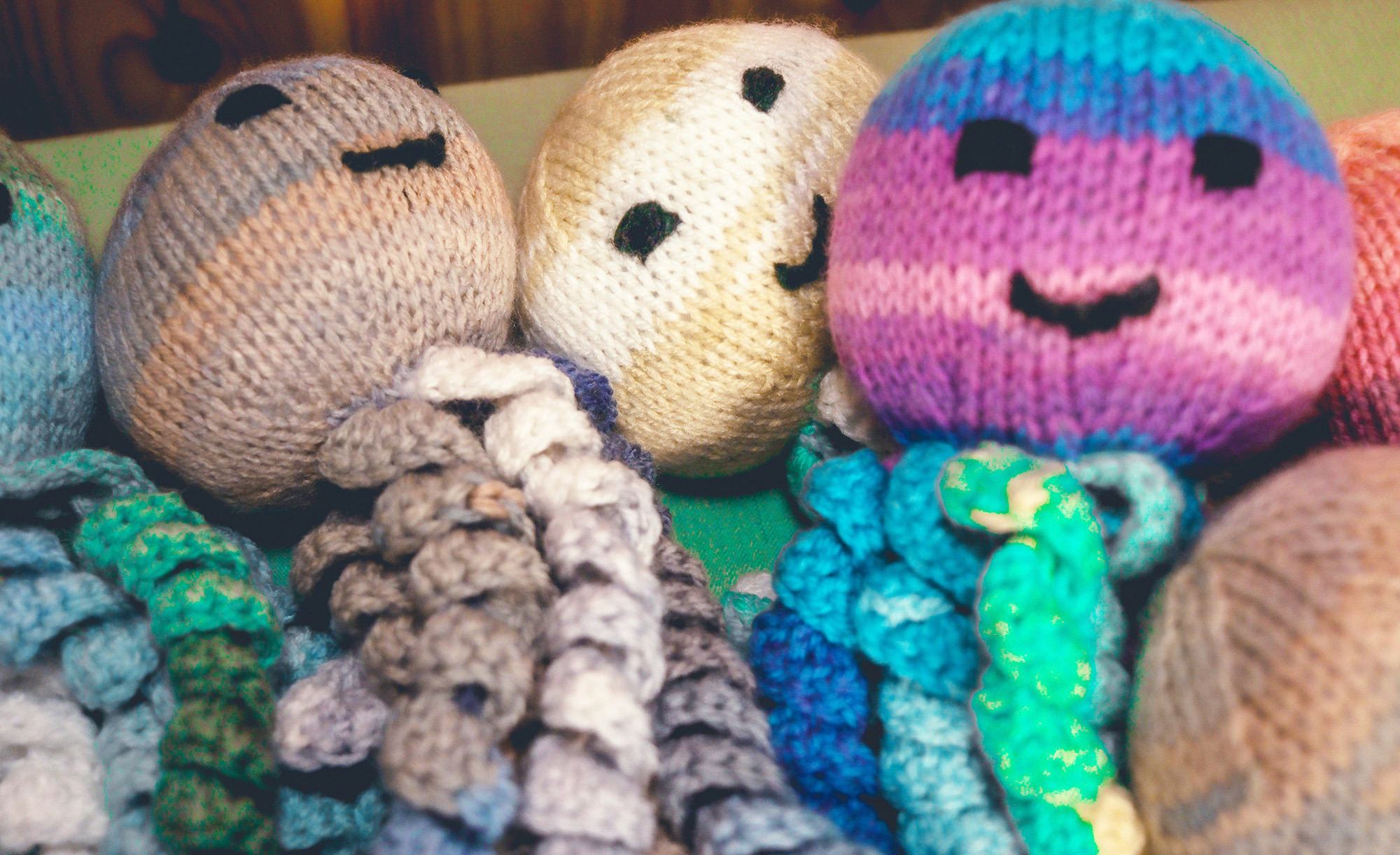 An image of handmade cuddly octopus toys.