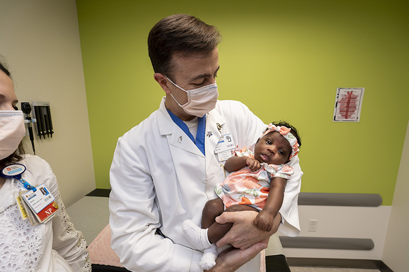 Dr. Fleenor holding baby Samirah.