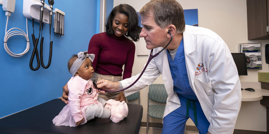 Dr. Vance with a patient in the cardiology clinic.