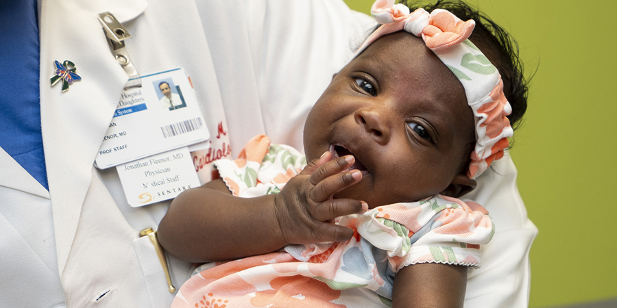 Close up of Samirah in Dr. Fleenor's arms.