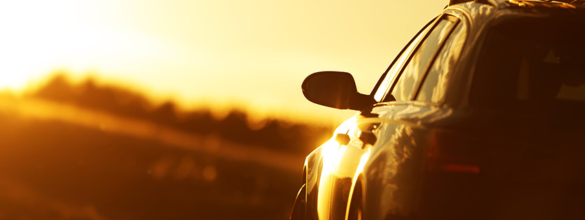 Golden Hour Car Road Trip. Scenic Countryside Road During Sunset