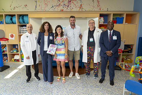 Marc And Audrey Leishman gather for a group photo with the CHKD Leadership Team