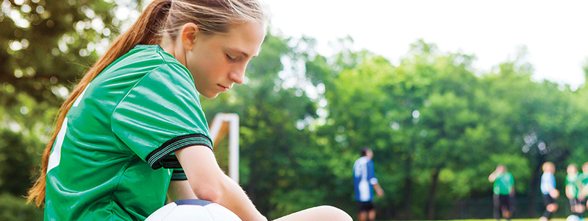 girl sitting alone