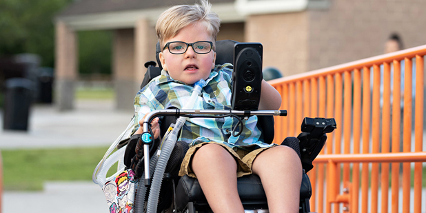 Child in Wheelchair Outside