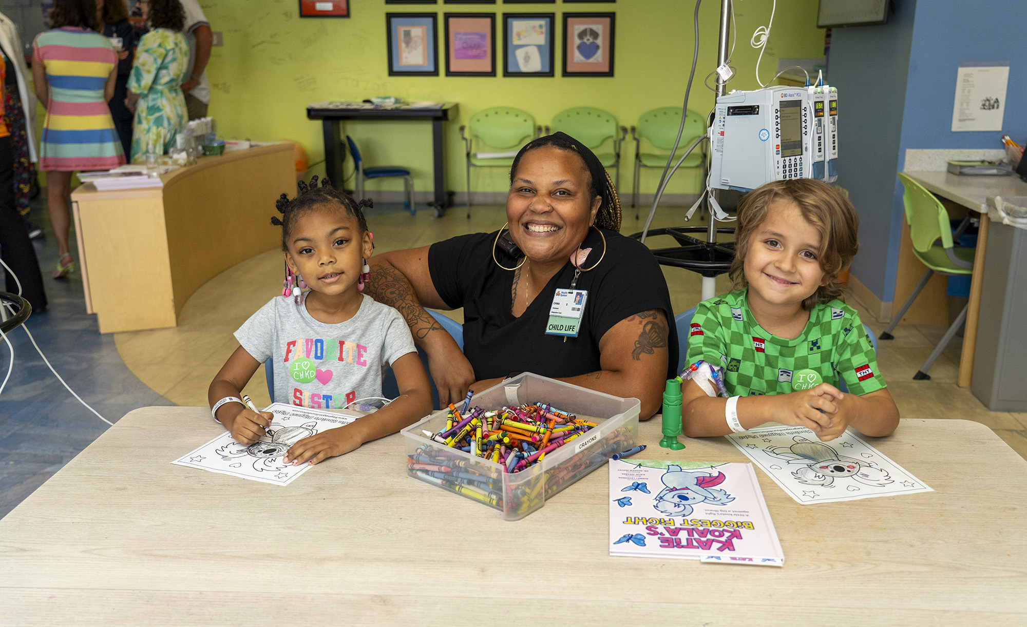 CHKD child life specialist playing in the playroom with a patient.